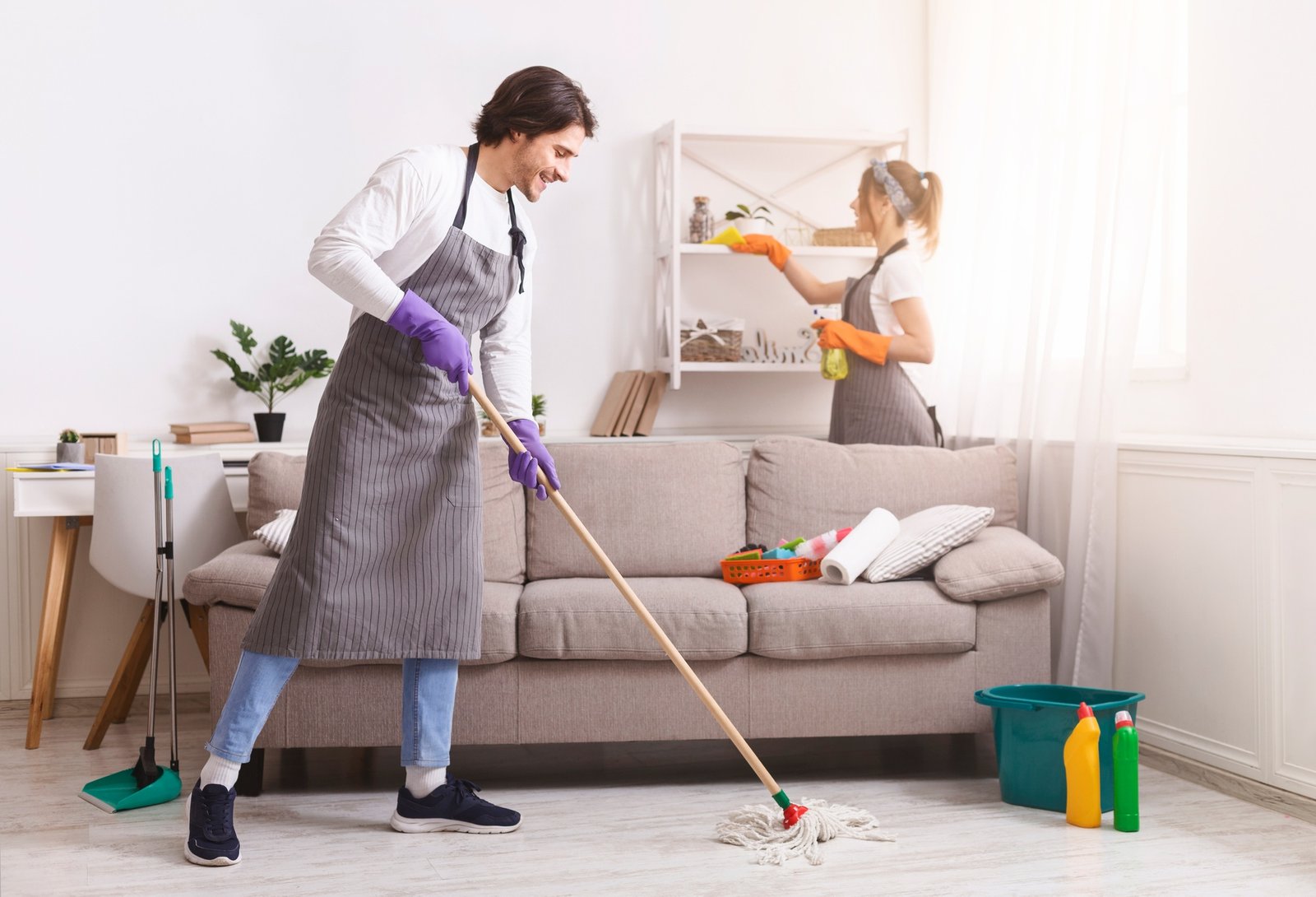 Residential Cleaning Services. Couple Of Skilled Housekeepers Tidying Up Apartment